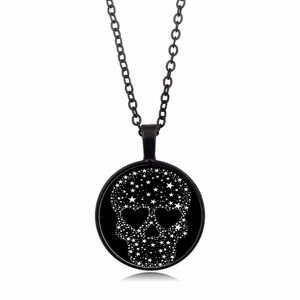 Vintage black skull necklace with star patterns and heart eyes on a crystal pendant