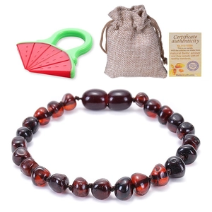 Natural Baltic amber baby bracelet set with watermelon teether and certificate in a linen bag