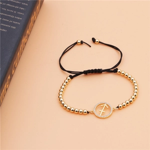 Detail of Sagittarius copper bracelet with micro-pave zircons and woven cord