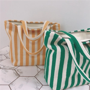 Vertical striped canvas tote bags with smooth zipper closure and sturdy thick handles