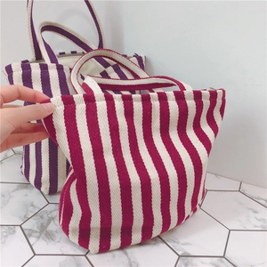 Vertical striped canvas handbag with thick cotton fabric and zipper closure