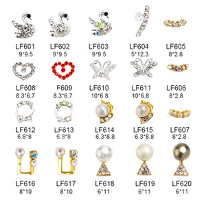 Macro display of assorted alloy nail art charms with star heart and butterfly designs