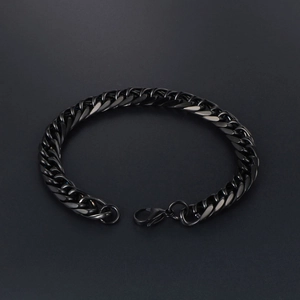 Minimalist black stainless steel chain bracelet with lobster clasp on grey background