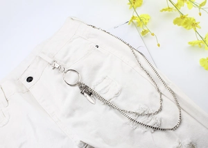 Double-layered silver trouser chain featuring a detailed feather pendant and lobster clasp
