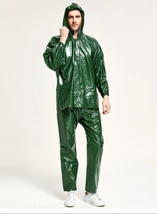Detail of dark green waterproof heavy-duty PVC raincoat set with hood and trousers