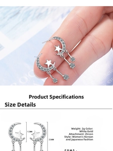 Detail view of silver moon and star earrings with pavé zircons and measurements