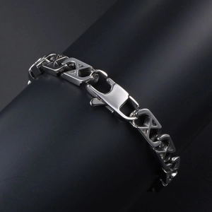 Polished silver mesh titanium steel bracelet with geometric X-links on a black display