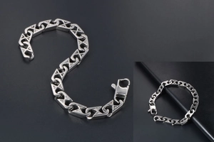 Macro detail of silver mesh chain bracelet with geometric H-links and lobster clasp