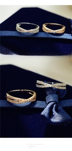 Close-up of interlocking crisscross rings with pavé micro-inlaid shimmering crystals