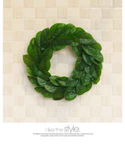 Close-up of artificial magnolia leaf wreath with natural green textures for home decor