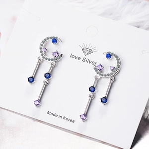Starry sky silver moon tassel earrings with sparkling blue and purple cubic zirconia