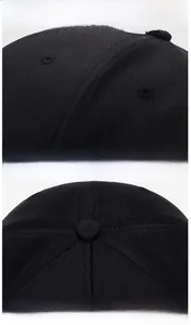 Close-up of stitching and breathable mesh fabric on black fitted baseball cap