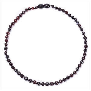 Detailed view of Baltic amber baby teething necklace with smooth dark irregular beads