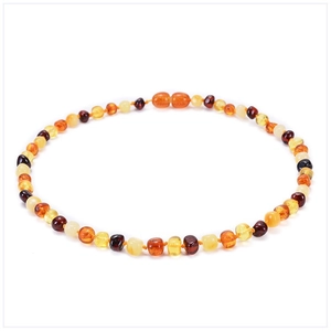 Detailed overhead view of a multi-colored Baltic amber bead necklace for infants