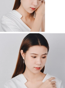 Close-up of star tassel earrings on model featuring elegant S925 silver fringe design