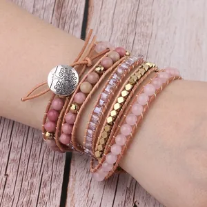 Multilayer bohemian wrap bracelet with pink quartz beads and tree of life clasp on wrist