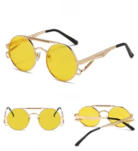 Detail view of steampunk round metal sunglasses with spring bridge and yellow lenses