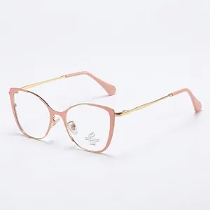 Cat-eye anti-blue light glasses with pink and gold metal frame from a 45-degree angle