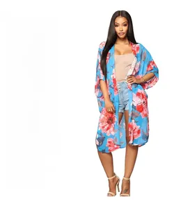 Floral print long cardigan with red flowers and batwing sleeves on a blue background