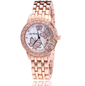 Detail of rose gold watch with mother of pearl dial and crystal butterfly accents