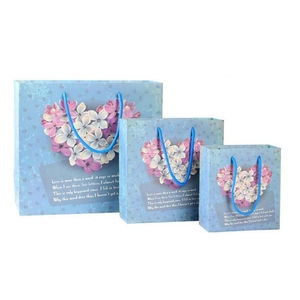Set of three floral heart paper gift bags in light blue with elegant carry handles
