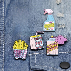 Set of 5 colorful enamel detergent and fries pins on denim background for bags and clothes