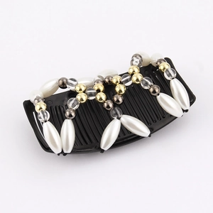 Detail showing elegant white pearls and smoke crystals on a black beaded magic hair comb