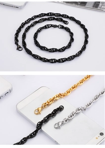 Close-up of 18K gold and black plated stainless steel mesh necklaces and lobster clasps