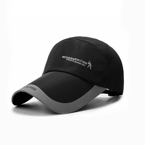 Close-up of the long brim on a black and grey outdoor hiking baseball cap with DERM lettering