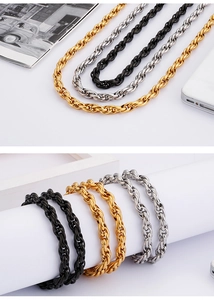 Detail view of gold, silver and black stainless steel rope chains in three colors