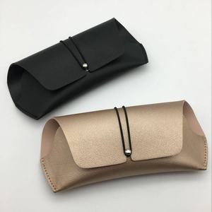Detail of PU leather glasses pouches in black and rose gold with elastic drawstring closure