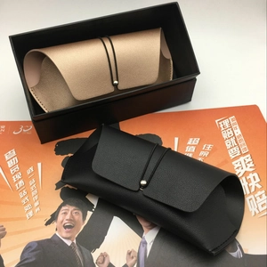 Detail of leather sunglasses pouch with envelope flap and metal button closure mechanism