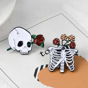 Gothic punk skull and ribcage enamel pin set with rose and flower details for Halloween