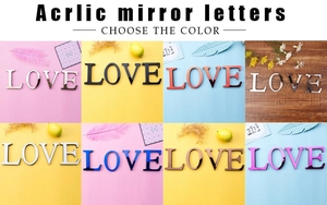 Detailed view showing multiple color options for acrylic mirror letter wall stickers