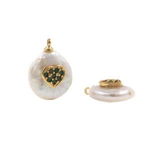 Detailed view of Baroque pearl pendant with micro-inset green heart crystal and gold plating