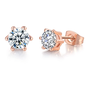 Detail of rose gold six-prong crown stud earrings featuring round brilliant cut zircons