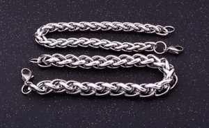 Detail shot of silver wheat link chain bracelets with lobster clasp on black background