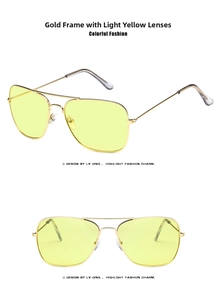 Detail view of retro double bridge aviator sunglasses with gold frame and yellow lenses