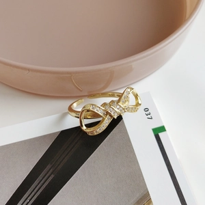 Minimalist S925 sterling silver bow ring with gold plating and sparkling zircon stones