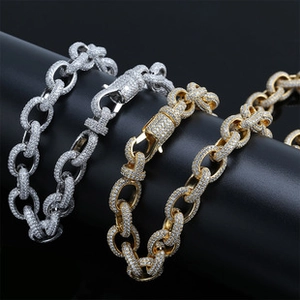 Close-up of hip hop lock necklaces in gold and silver finish with full zircon inlay