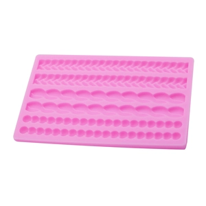 Pink silicone pearl rope weave border mold for fondant cake decoration on white background