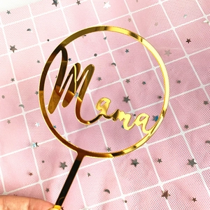 Mirror gold acrylic Mama cake topper detail with glossy finish and elegant cursive lettering