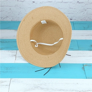 Foldable beige straw sun hat with wide brim and elastic wind string for women beach
