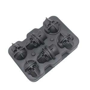 Close-up of 6-cavity black silicone mold for making 3D skull-shaped ice or chocolates