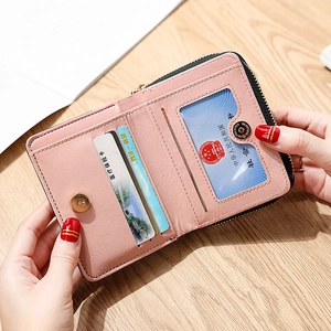Minimalist light pink PU leather mini wallet with card slots and a clear ID window
