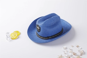 Blue denim style straw hat with metal badge crest and black patterned decorative band