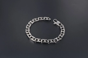 Detail of silver titanium mesh bracelet with textured rectangular links and lobster clasp
