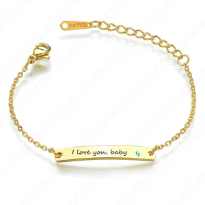 Pulsera infantil de acero inoxidable dorado pulido con grabado I Love You Baby y pies azules
