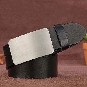 Detailed macro view of black leather belt with silver brushed metal pin buckle