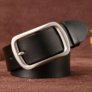Close-up of a vintage silver pin buckle on a premium black leather belt for men